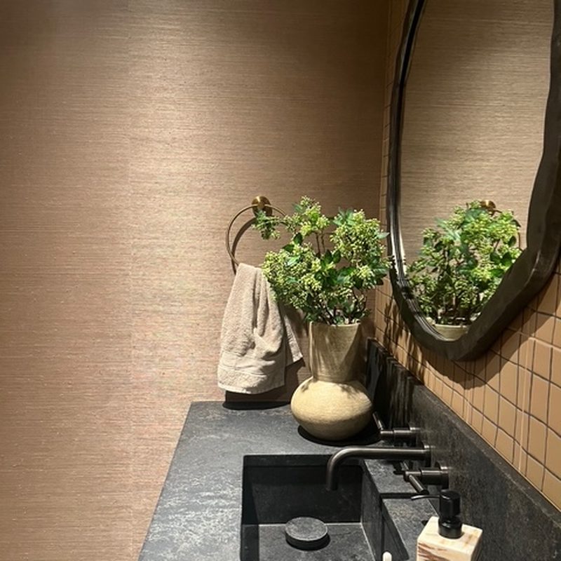 Kelowna grasscloth wallpaper installation in a modern powder room