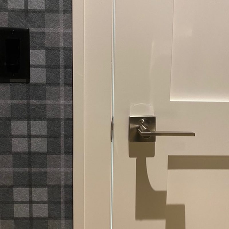 Kelowna grey plaid wallpaper installation in a hallway