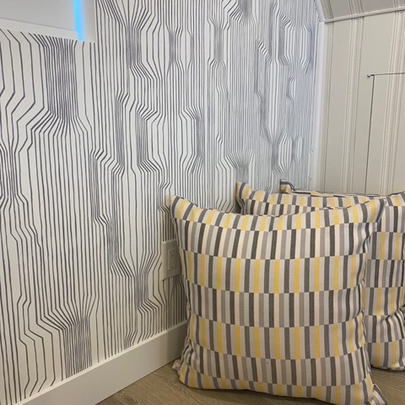 Lake Country graphic stripe wallpaper installation in a living room
